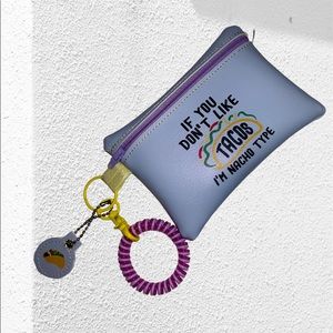 Handcrafted taco bag in vinyl . Violet color w/matching zipper. Wristlet & tag